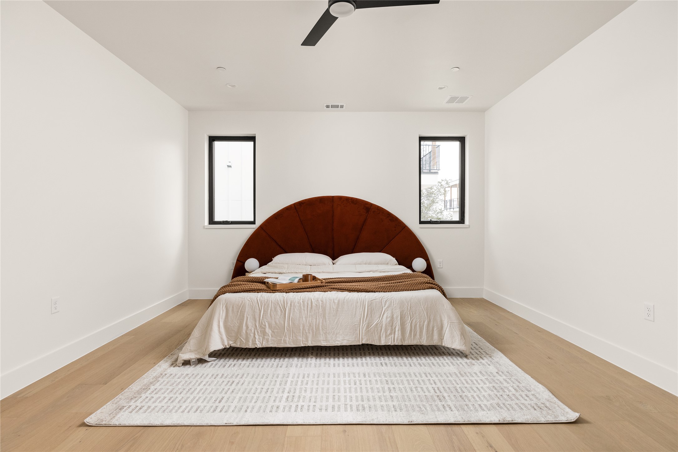 4414 South 1st Street, Unit 3 Austin, TX 78745 - Photo 23 of 39 Bedroom featuring light wood-style floors and a ceiling fan