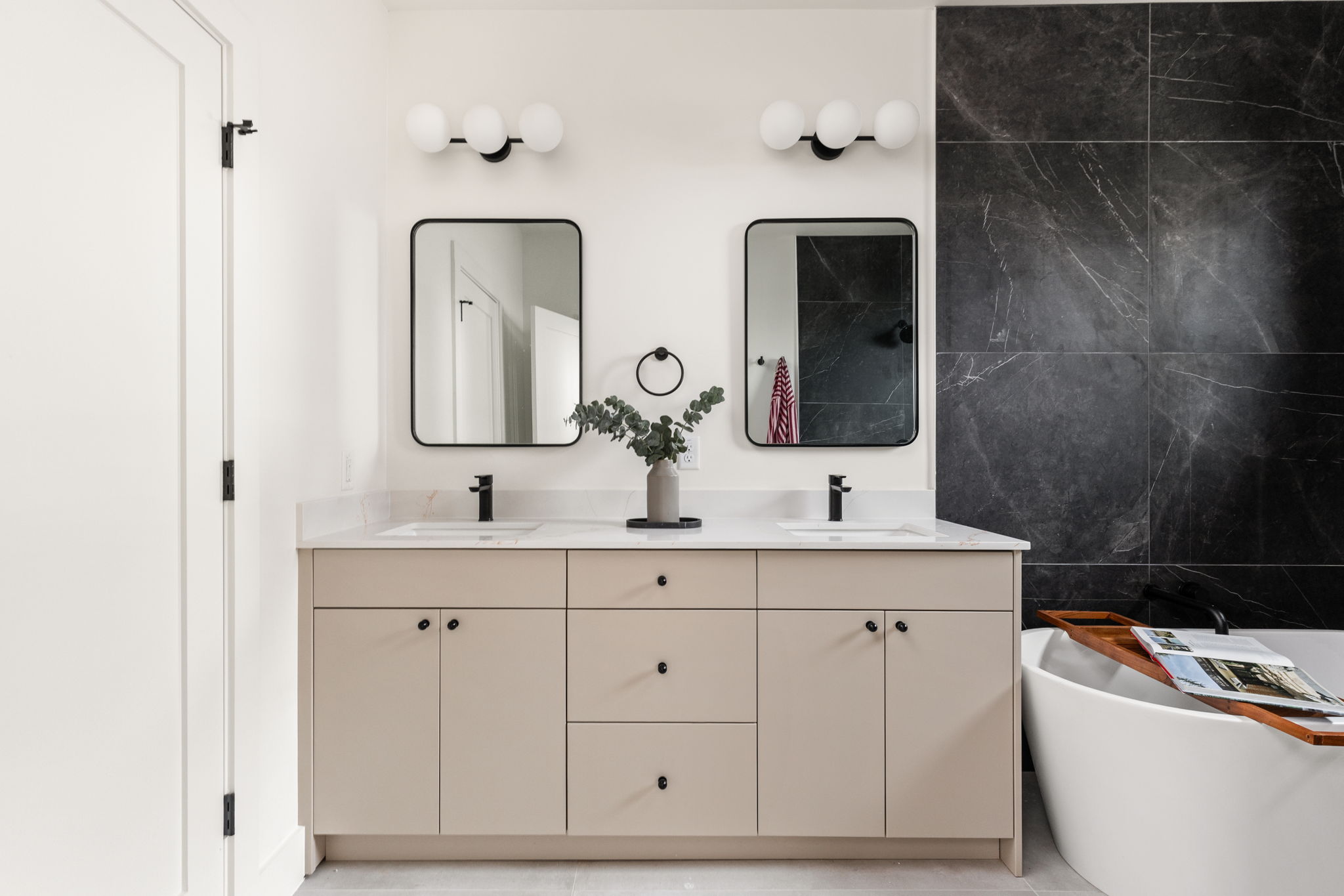 4414 South 1st Street, Unit 3 Austin, TX 78745 - Photo 33 of 39 Bathroom with a freestanding tub, double vanity, and tile walls