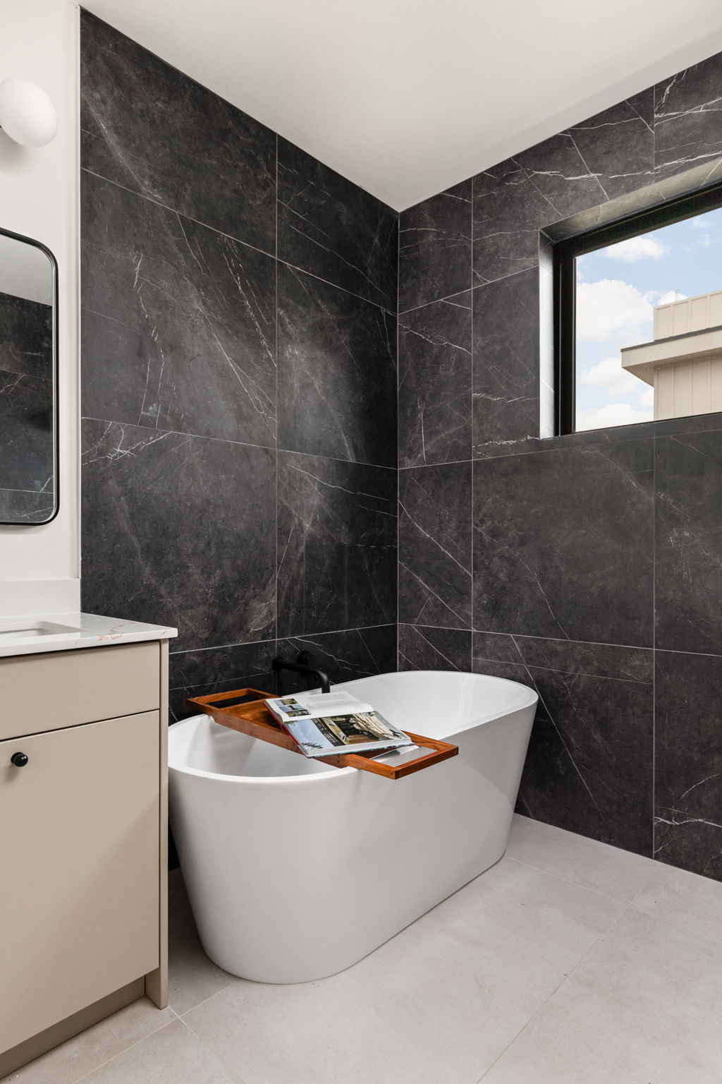 4414 South 1st Street, Unit 3 Austin, TX 78745 - Photo 36 of 39 Full bath featuring tile walls, a freestanding bath, and vanity