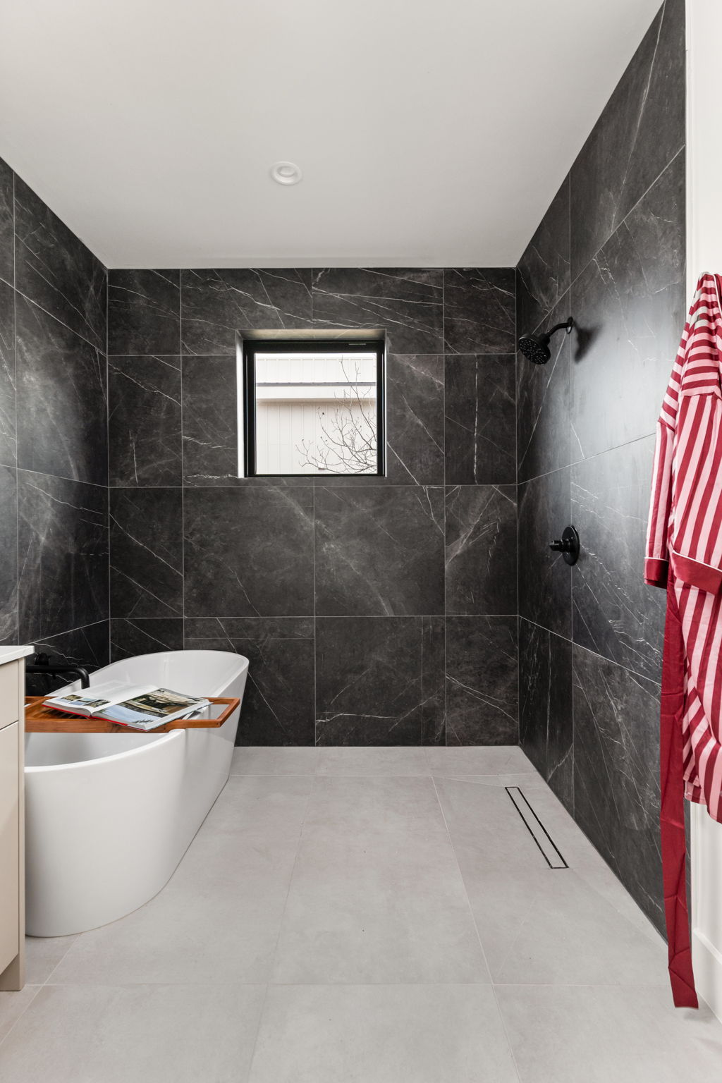 4414 South 1st Street, Unit 3 Austin, TX 78745 - Photo 38 of 39 Bathroom with a tile shower, a freestanding bath, tile walls, and vanity