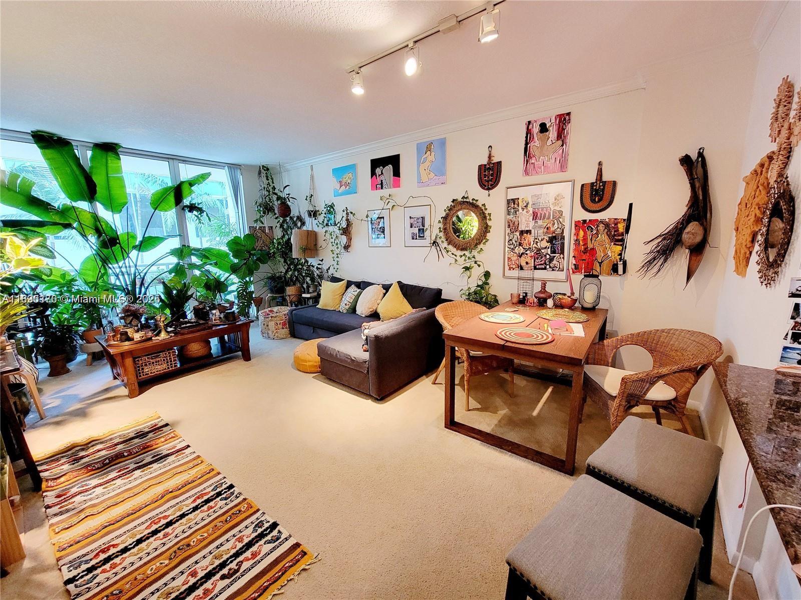 2000 North Bayshore Drive, Unit 226 Miami, FL 33137 - Photo 4 of 15 a living room with furniture and a potted plant