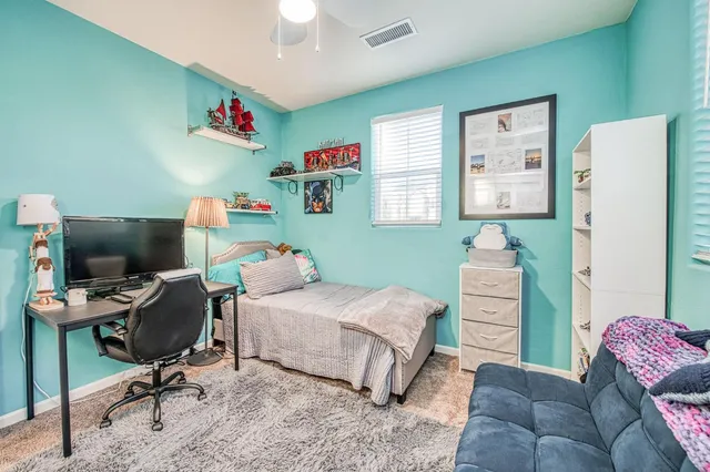 a bathroom with a sink a toilet and a large mirror