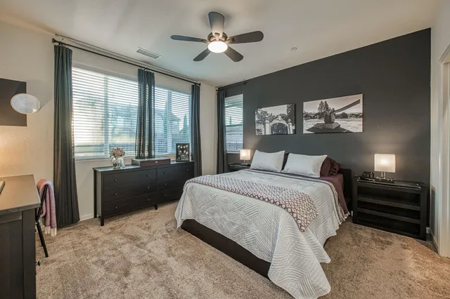 a view of a patio with couches and potted plants