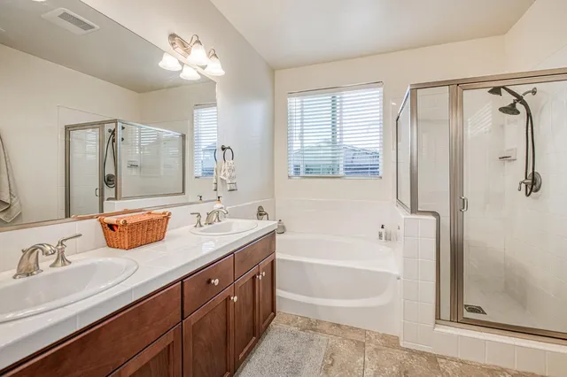 a view of a patio with couches and potted plants