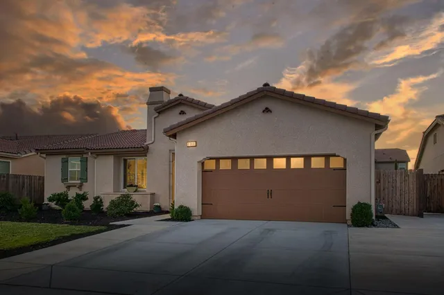 a front view of a house with a garage