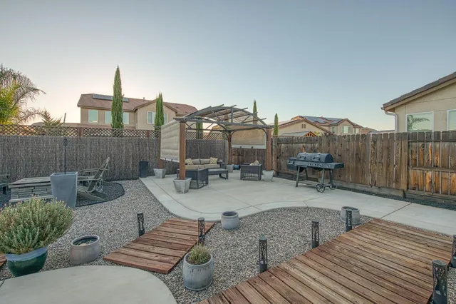 a view of a patio with couches and potted plants