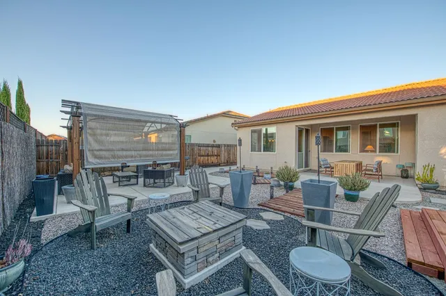 a view of a backyard with a patio