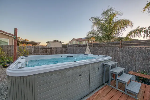a backyard of a house with sofas