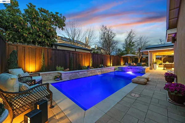 a view of swimming pool with seating space