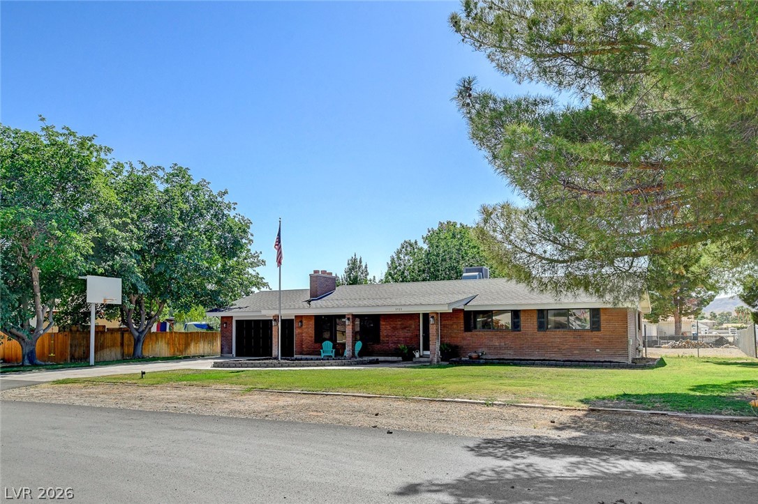 3765 Berkeley Street Logandale, NV 89021 - Photo 9 of 87 This charming residence features a classic brick exterior and a well-maintained front yard.