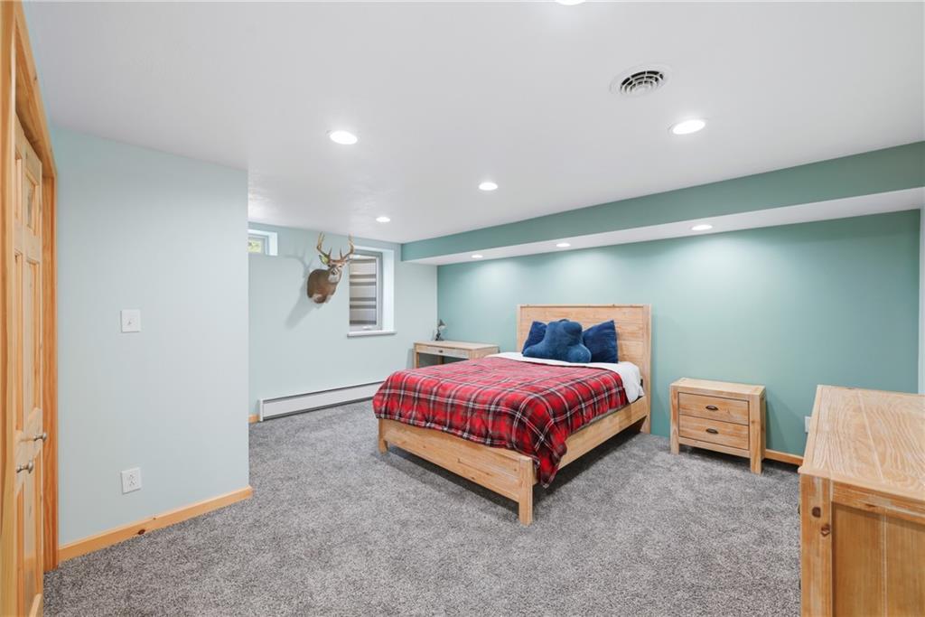 200 Hazen Road Sharpsville, PA 16150 - Photo 28 of 41 a spacious bedroom with a bed and a lamp