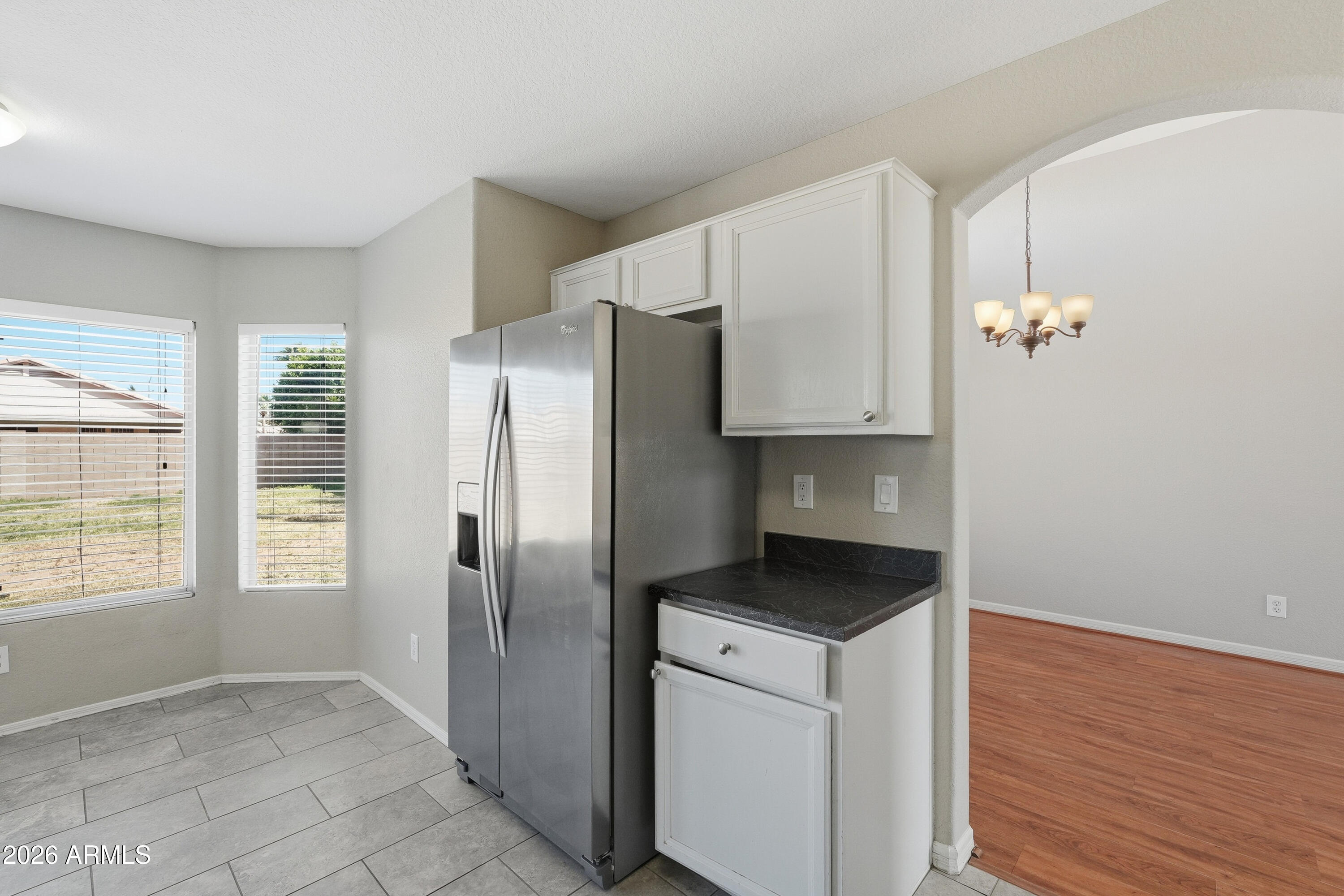 2840 East Wagoner Road Phoenix, AZ 85032 - Photo 14 of 34 a kitchen with a refrigerator and a stove top oven