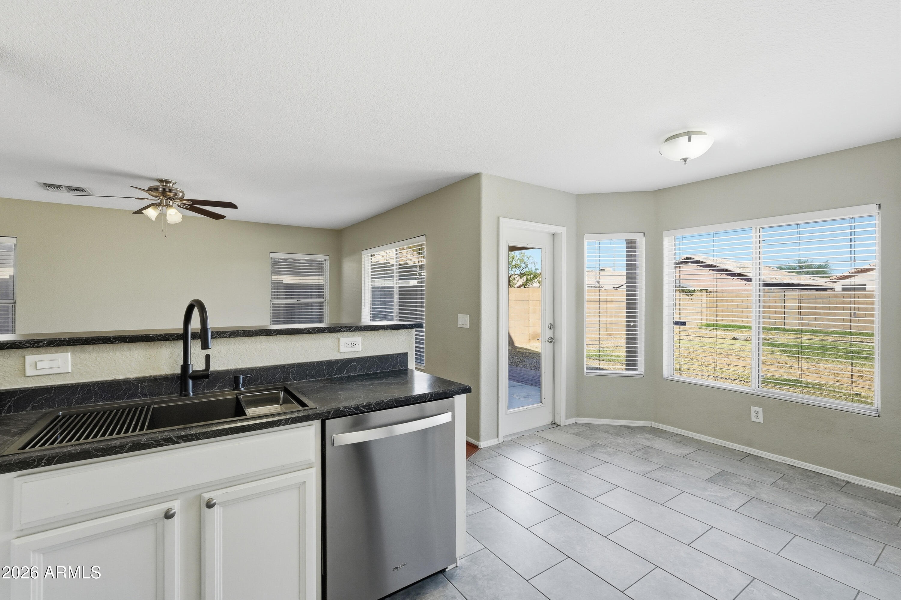 2840 East Wagoner Road Phoenix, AZ 85032 - Photo 15 of 34 a kitchen with granite countertop a sink and a stove