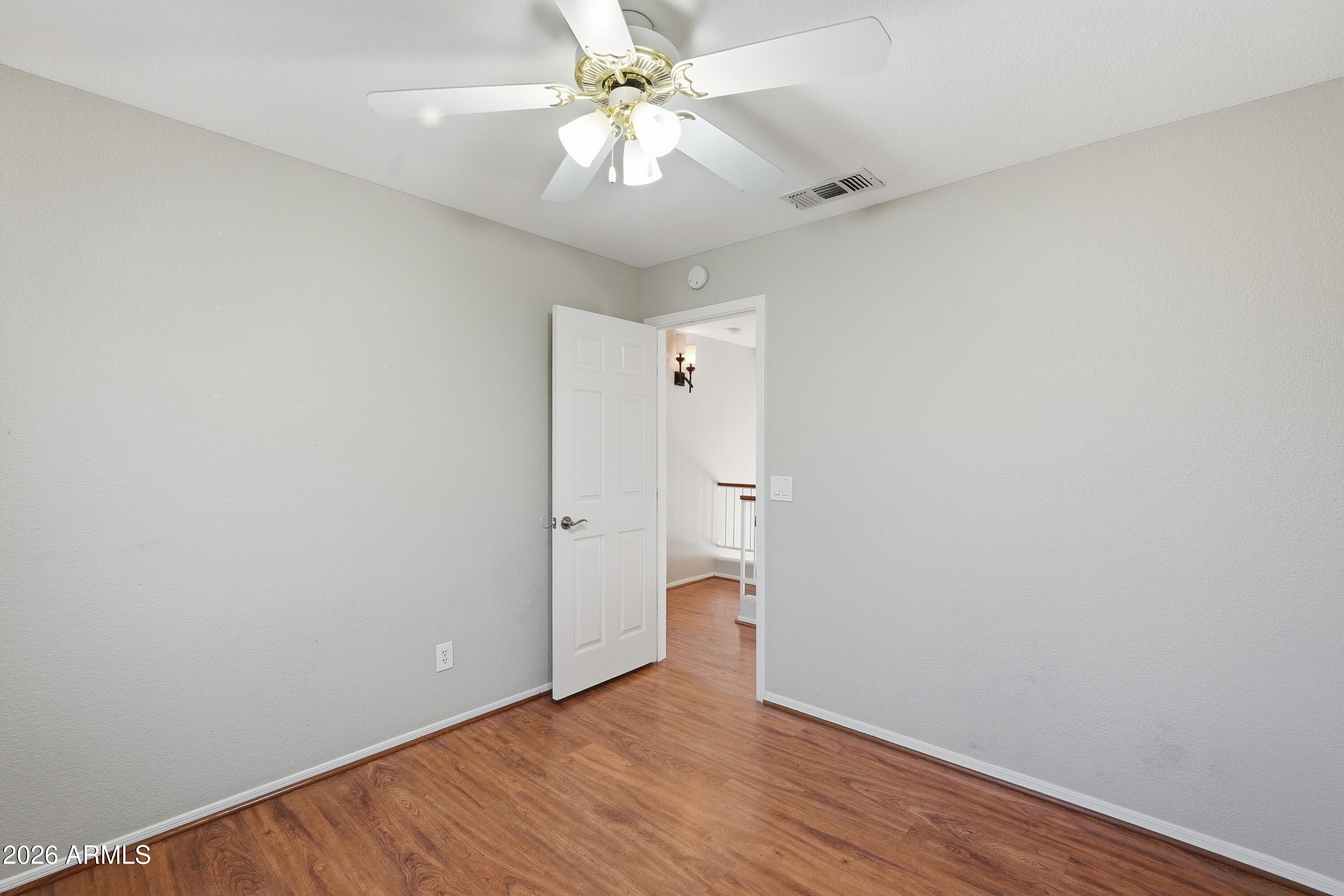 2840 East Wagoner Road Phoenix, AZ 85032 - Photo 20 of 34 a view of an empty room with a fan