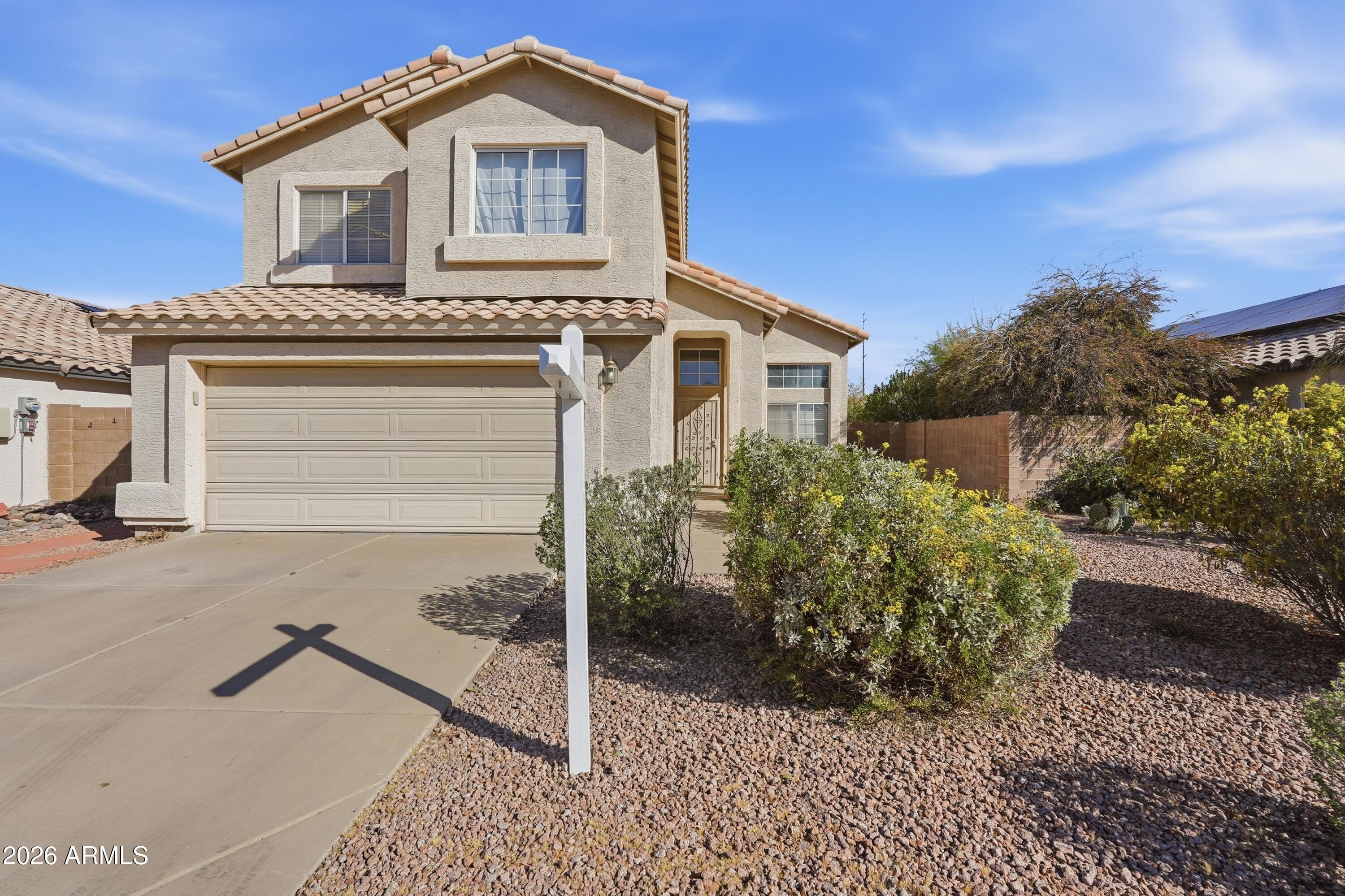 2840 East Wagoner Road Phoenix, AZ 85032 - Photo 2 of 34 a front view of a house with a yard