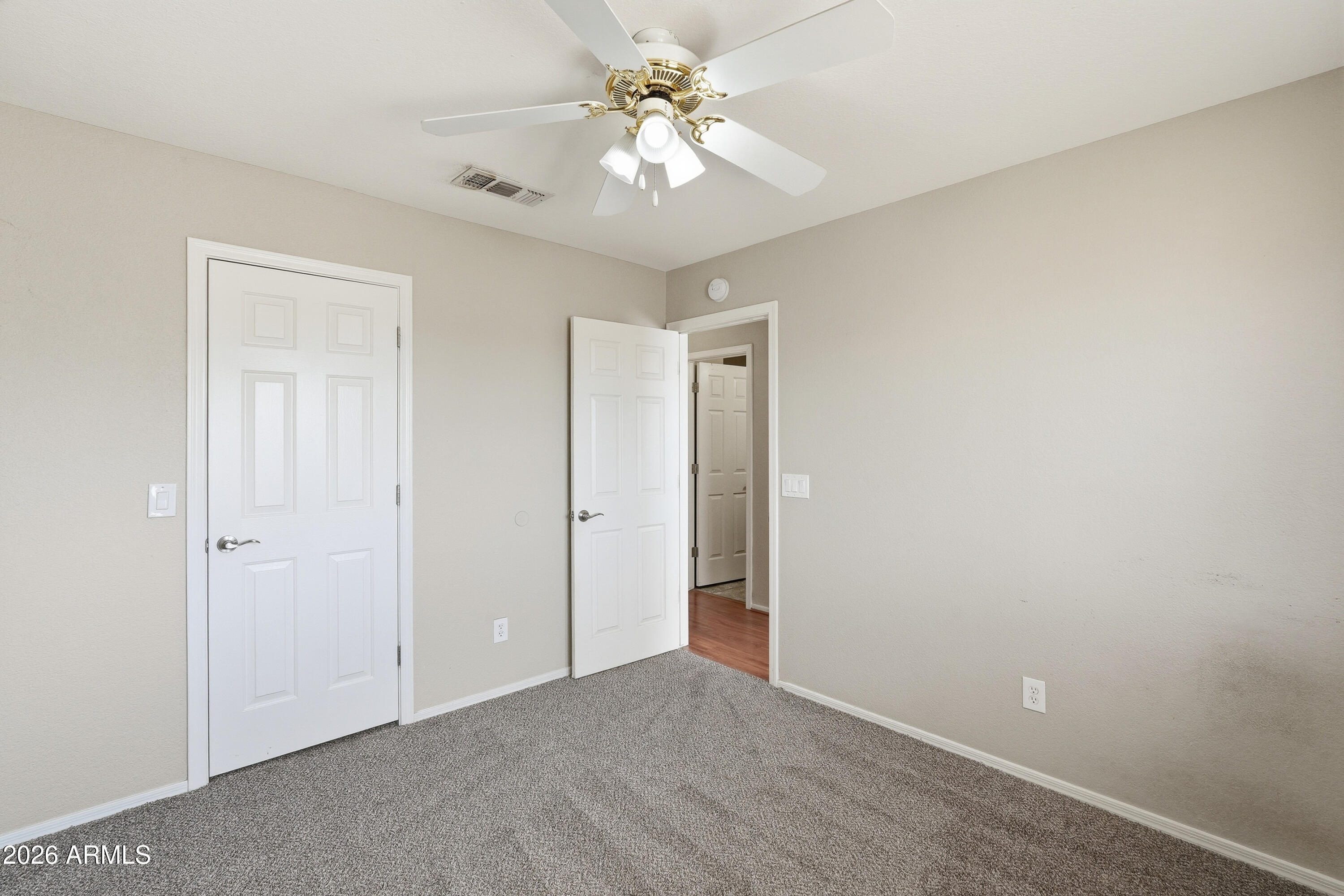 2840 East Wagoner Road Phoenix, AZ 85032 - Photo 22 of 34 a view of a room with a chandelier fan