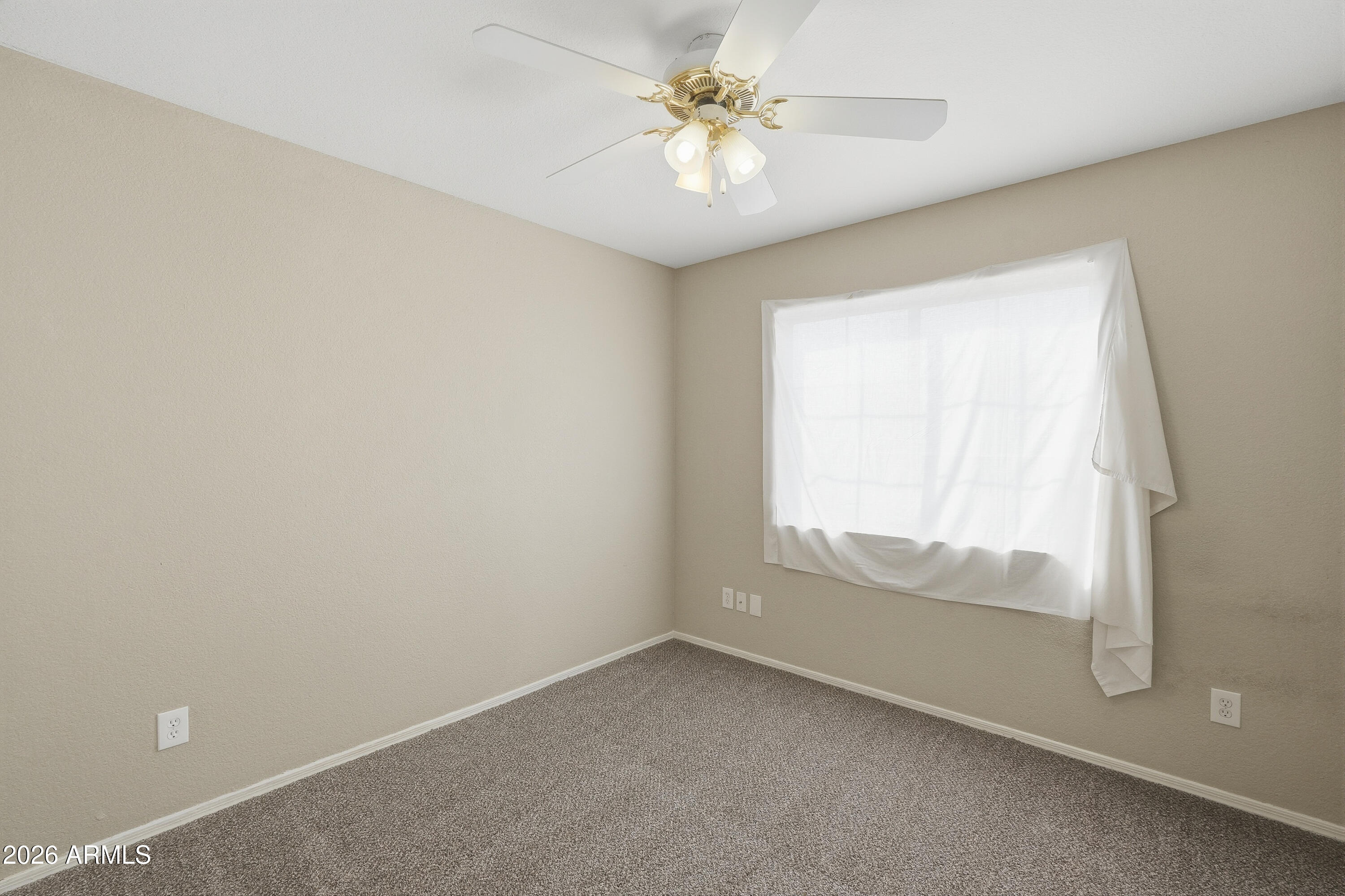 2840 East Wagoner Road Phoenix, AZ 85032 - Photo 23 of 34 an empty room with a window