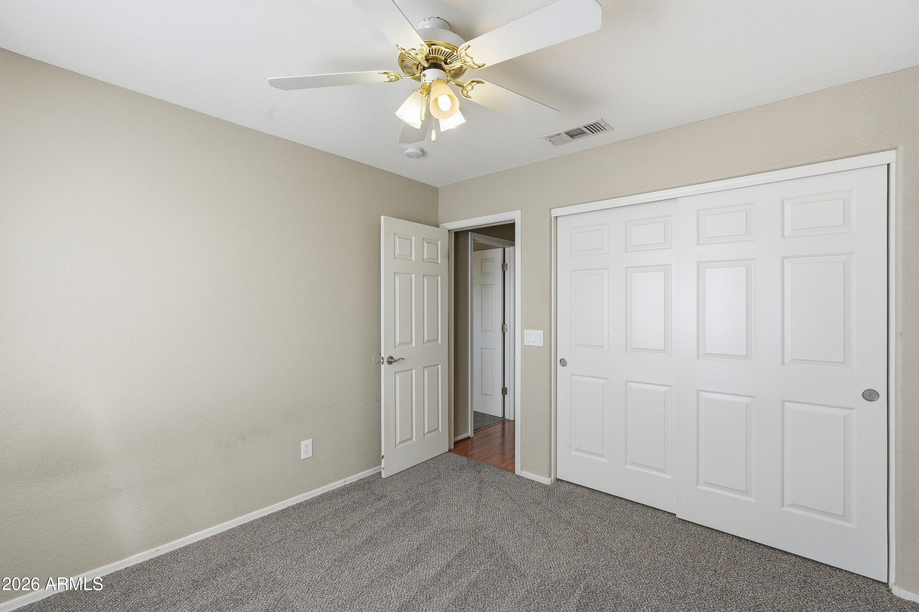2840 East Wagoner Road Phoenix, AZ 85032 - Photo 24 of 34 a view of a room with a chandelier fan