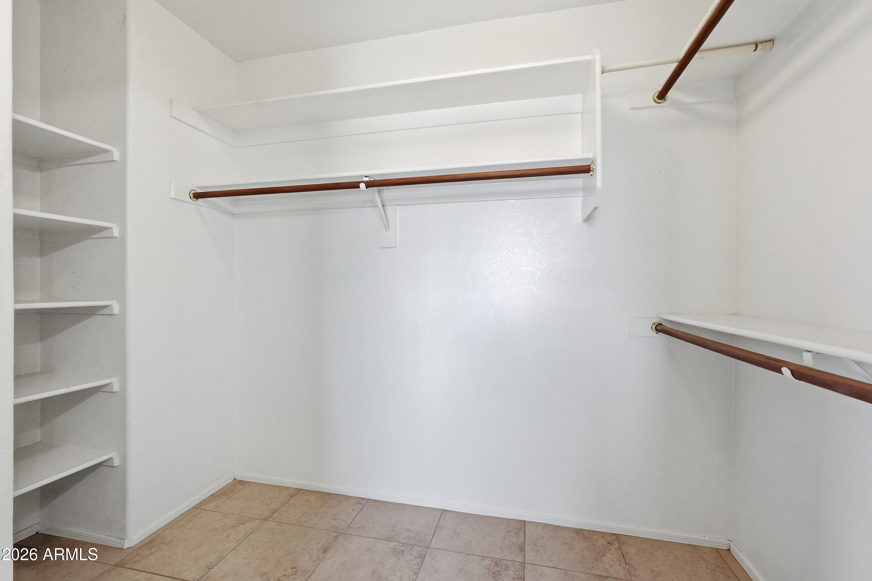 2840 East Wagoner Road Phoenix, AZ 85032 - Photo 25 of 34 a view of walk in closet with empty racks