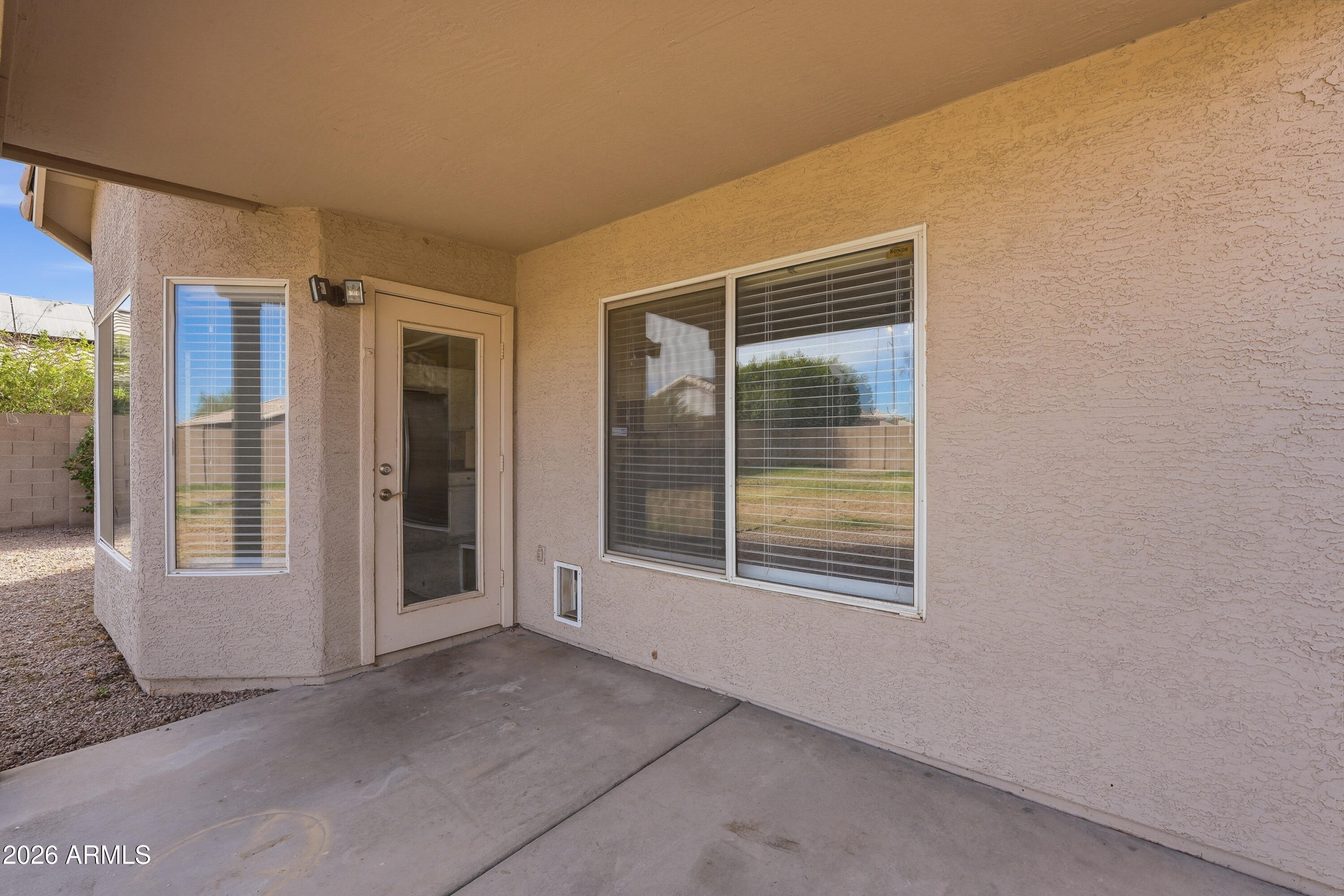 2840 East Wagoner Road Phoenix, AZ 85032 - Photo 31 of 34 a view of an empty room with glass door and windows