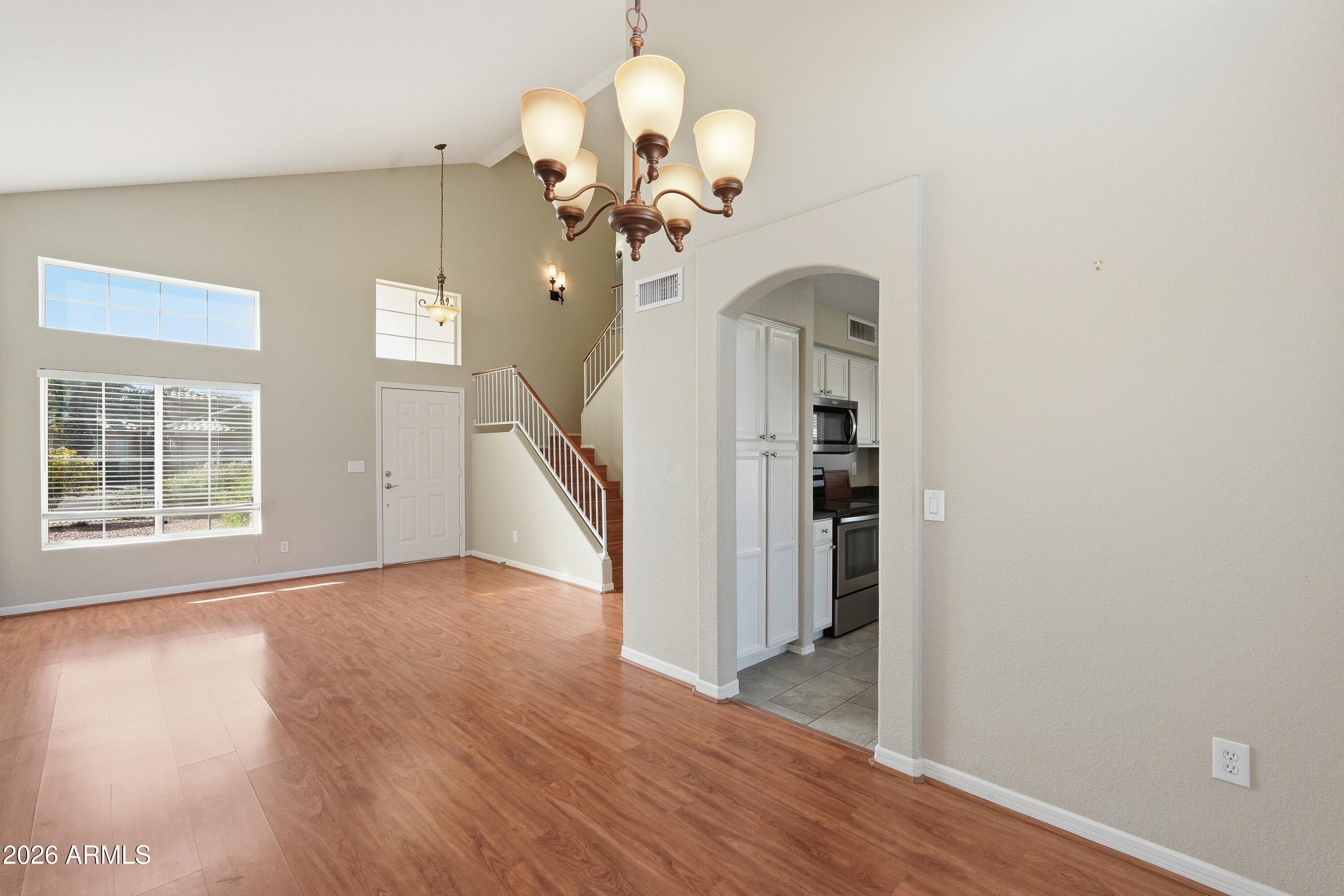 2840 East Wagoner Road Phoenix, AZ 85032 - Photo 5 of 34 a view of a room with wooden floor chandelier and entryway