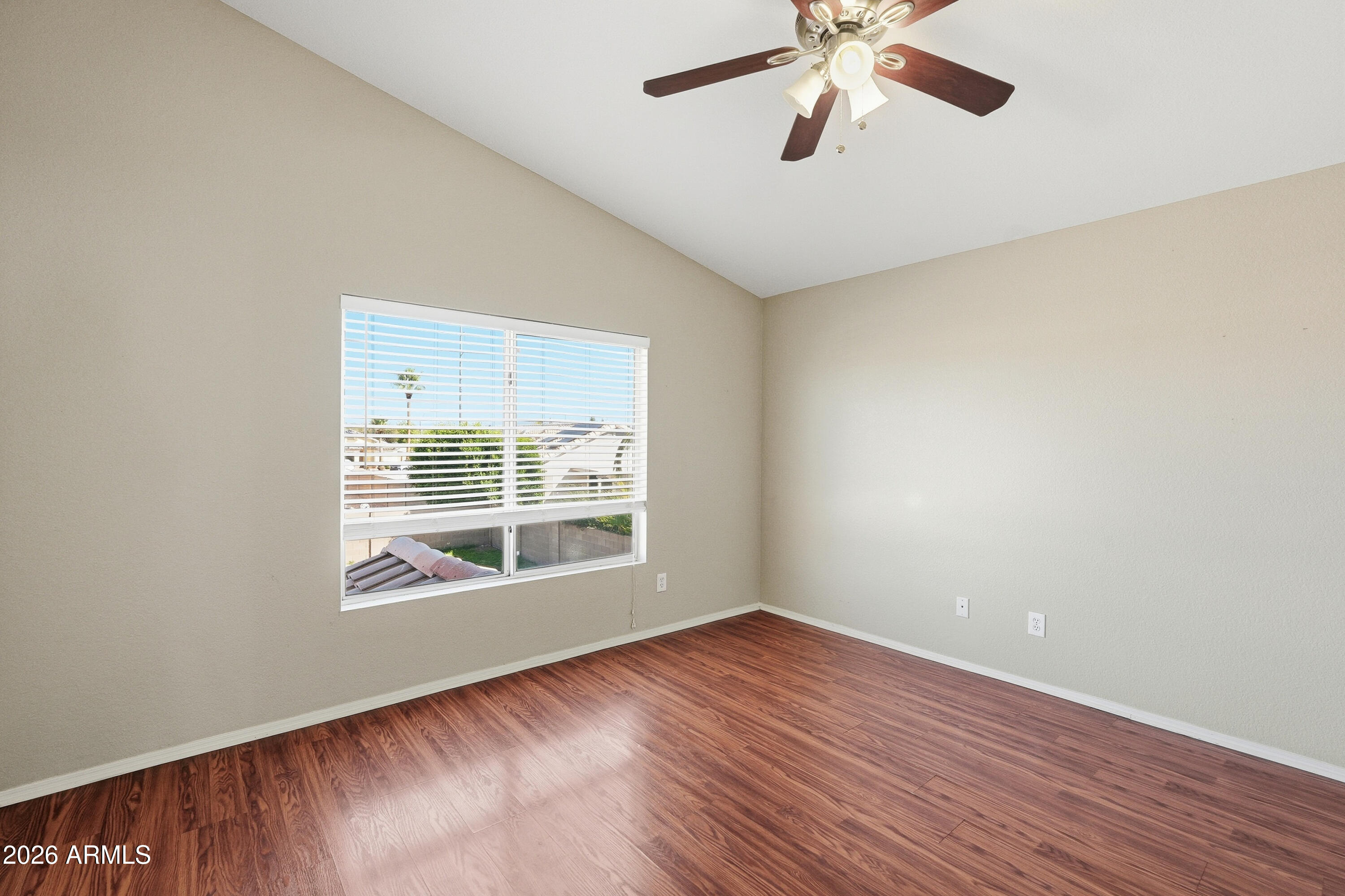 2840 East Wagoner Road Phoenix, AZ 85032 - Photo 9 of 34 wooden floor in an empty room with a window
