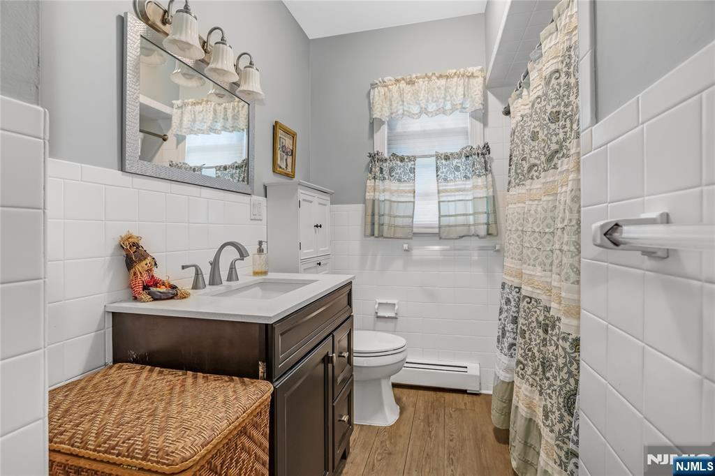 165 Pine Street Hackensack, NJ 07601 - Photo 15 of 41 a bathroom with a sink toilet and shower