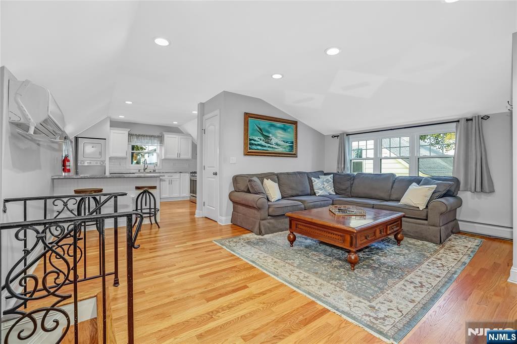 165 Pine Street Hackensack, NJ 07601 - Photo 32 of 41 a living room with furniture and a table
