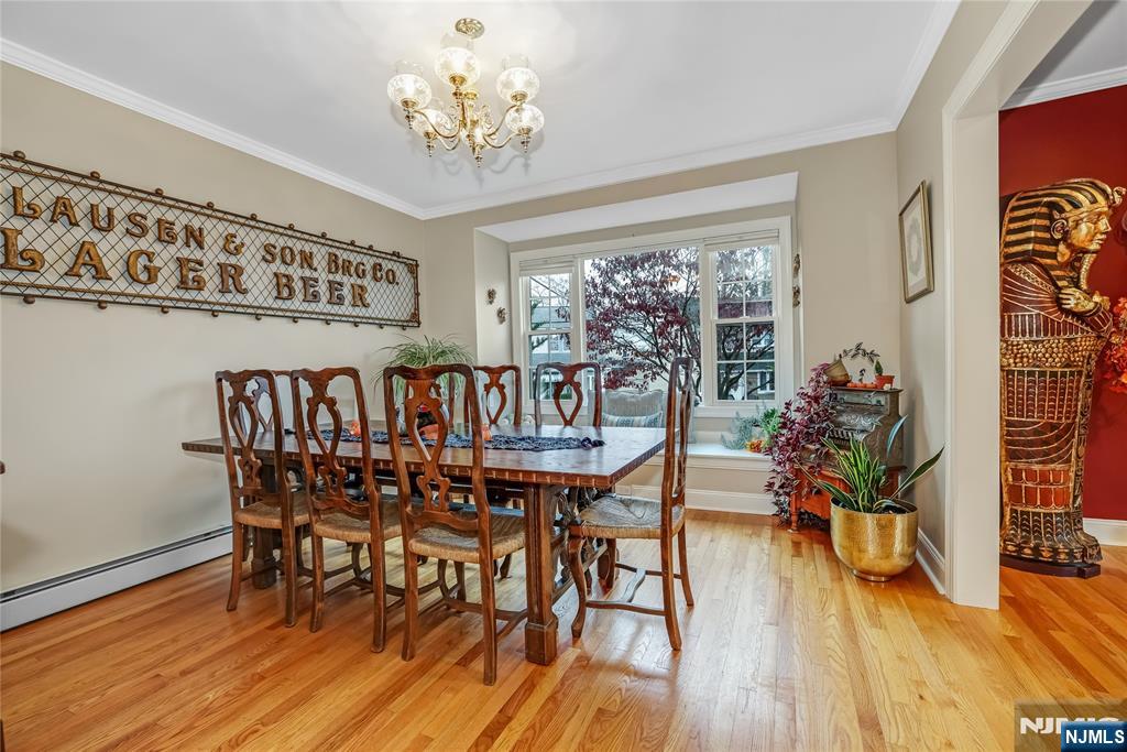 165 Pine Street Hackensack, NJ 07601 - Photo 8 of 41 a view of a dining room with furniture window and wooden floor