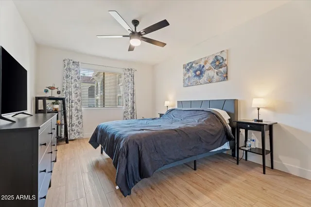a kitchen with stainless steel appliances a stove and white cabinets