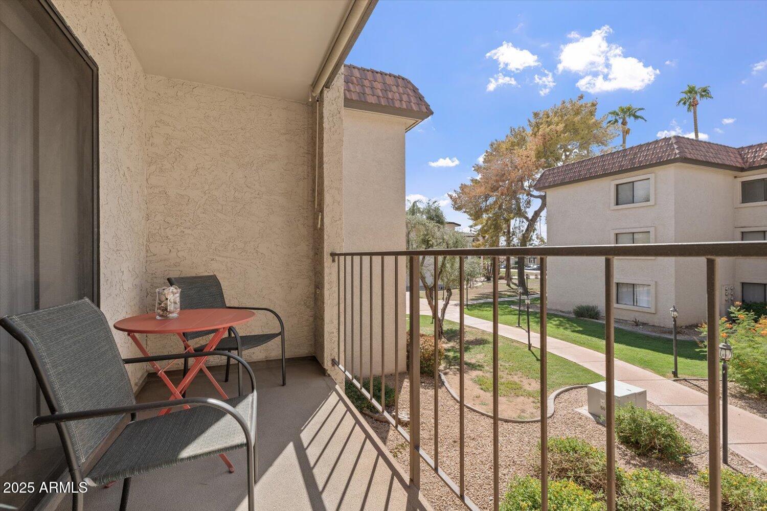3033 East Devonshire Avenue, Unit 2003 Phoenix, AZ 85016 - Photo 15 of 32 a view of a chairs and table in the balcony
