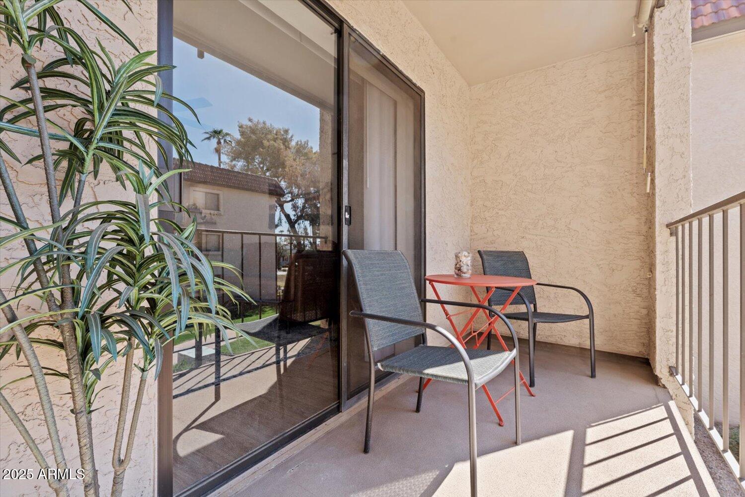 3033 East Devonshire Avenue, Unit 2003 Phoenix, AZ 85016 - Photo 16 of 32 a view of a chairs and table in a balcony