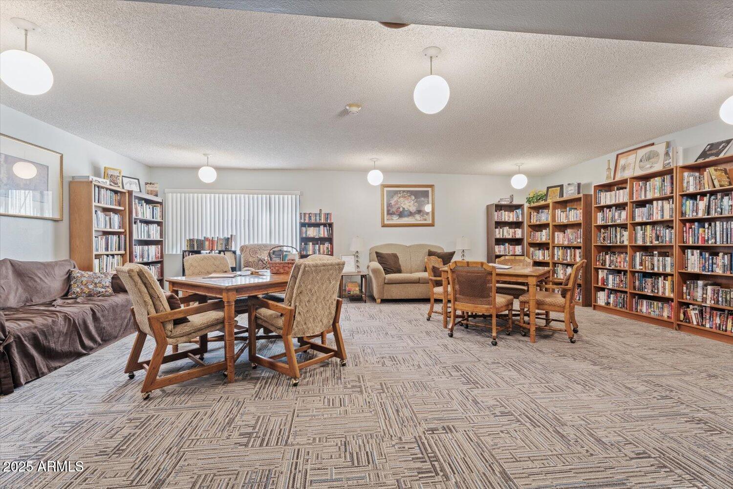 3033 East Devonshire Avenue, Unit 2003 Phoenix, AZ 85016 - Photo 17 of 32 a view of a livingroom with furniture and window