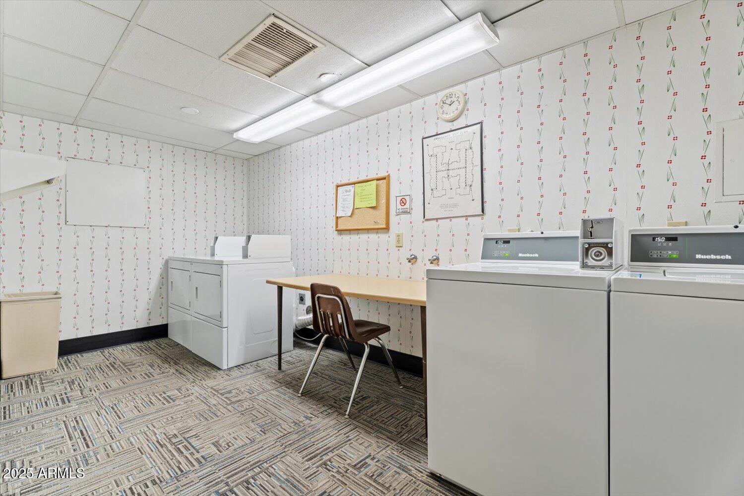 3033 East Devonshire Avenue, Unit 2003 Phoenix, AZ 85016 - Photo 19 of 32 a room with furniture a rug and white walls