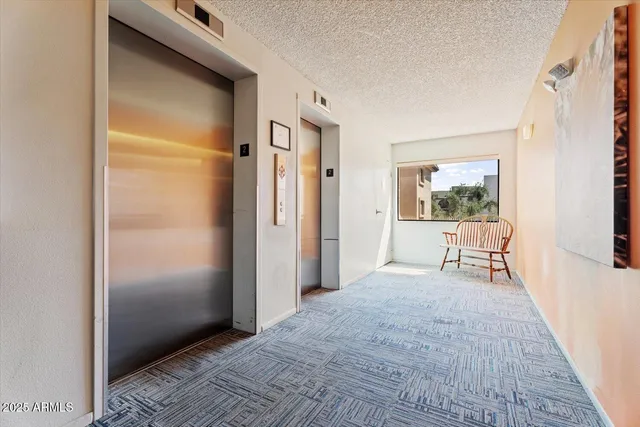 a view of a room with wooden floor and a window