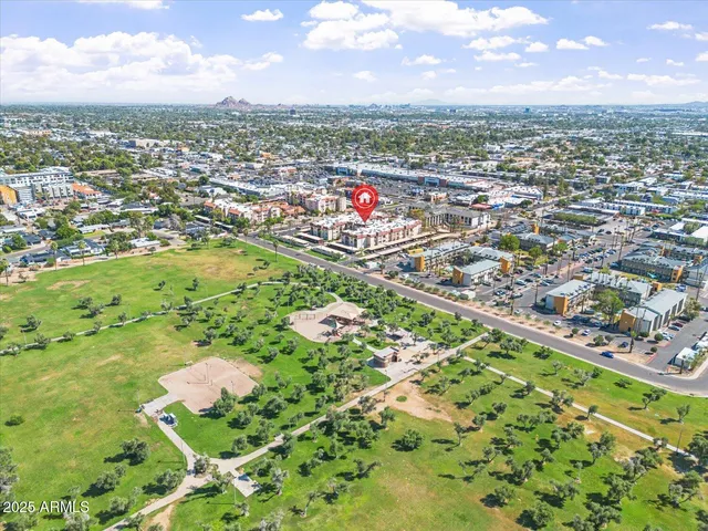an aerial view of residential houses with outdoor space