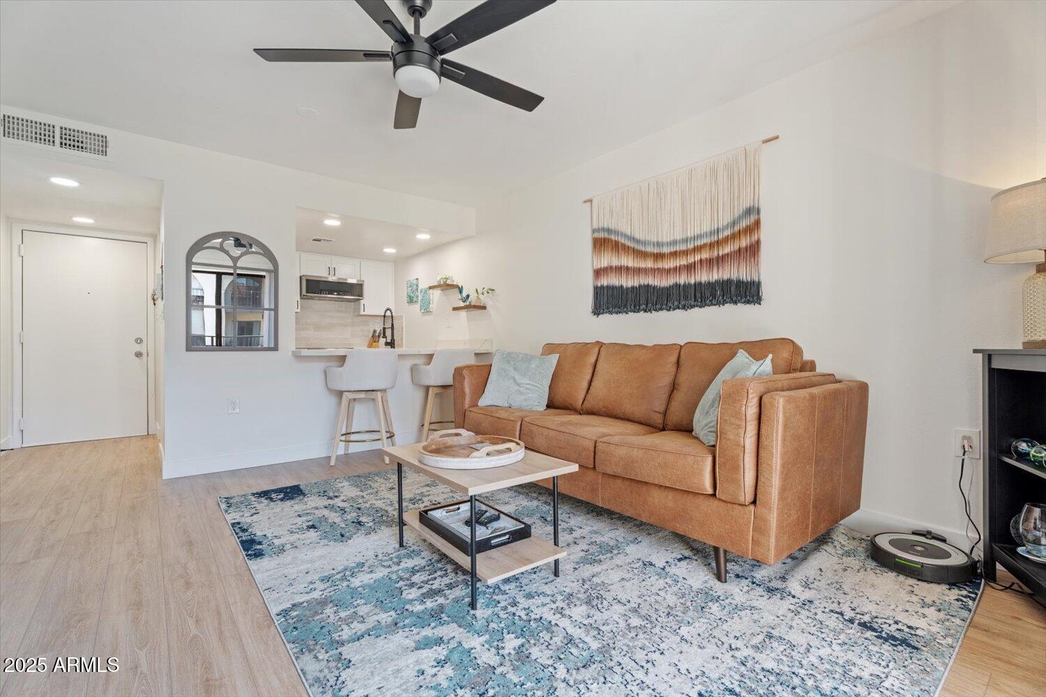 3033 East Devonshire Avenue, Unit 2003 Phoenix, AZ 85016 - Photo 6 of 32 a living room with furniture and a rug