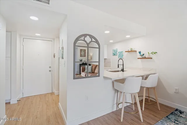 a living room with furniture and a rug