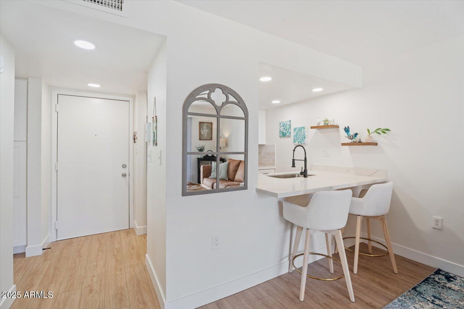 3033 East Devonshire Avenue, Unit 2003 Phoenix, AZ 85016 - Photo 7 of 32 a view of a livingroom with furniture wooden floor and a rug