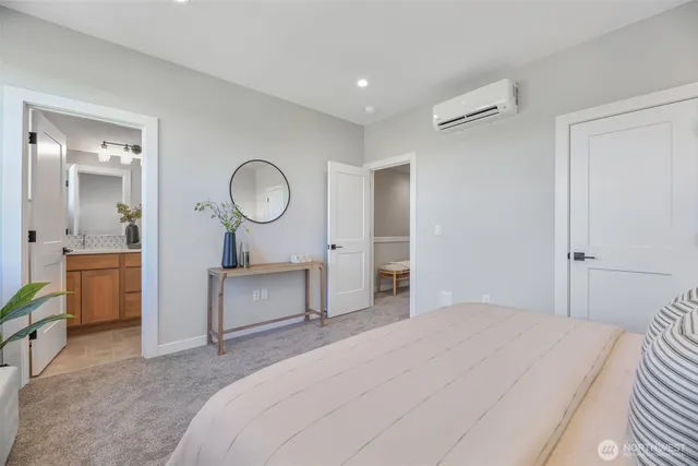 a bedroom with a bed and a dresser