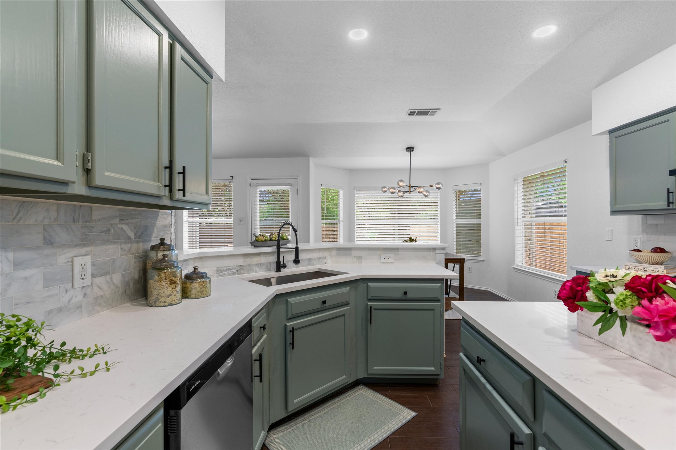 9305 Lightwood Loop Austin, TX 78748 - Photo 13 of 40 a kitchen with a sink stove and cabinets