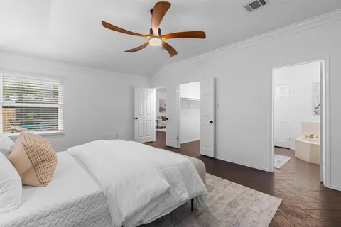 a bedroom with a bed and a view of bathroom