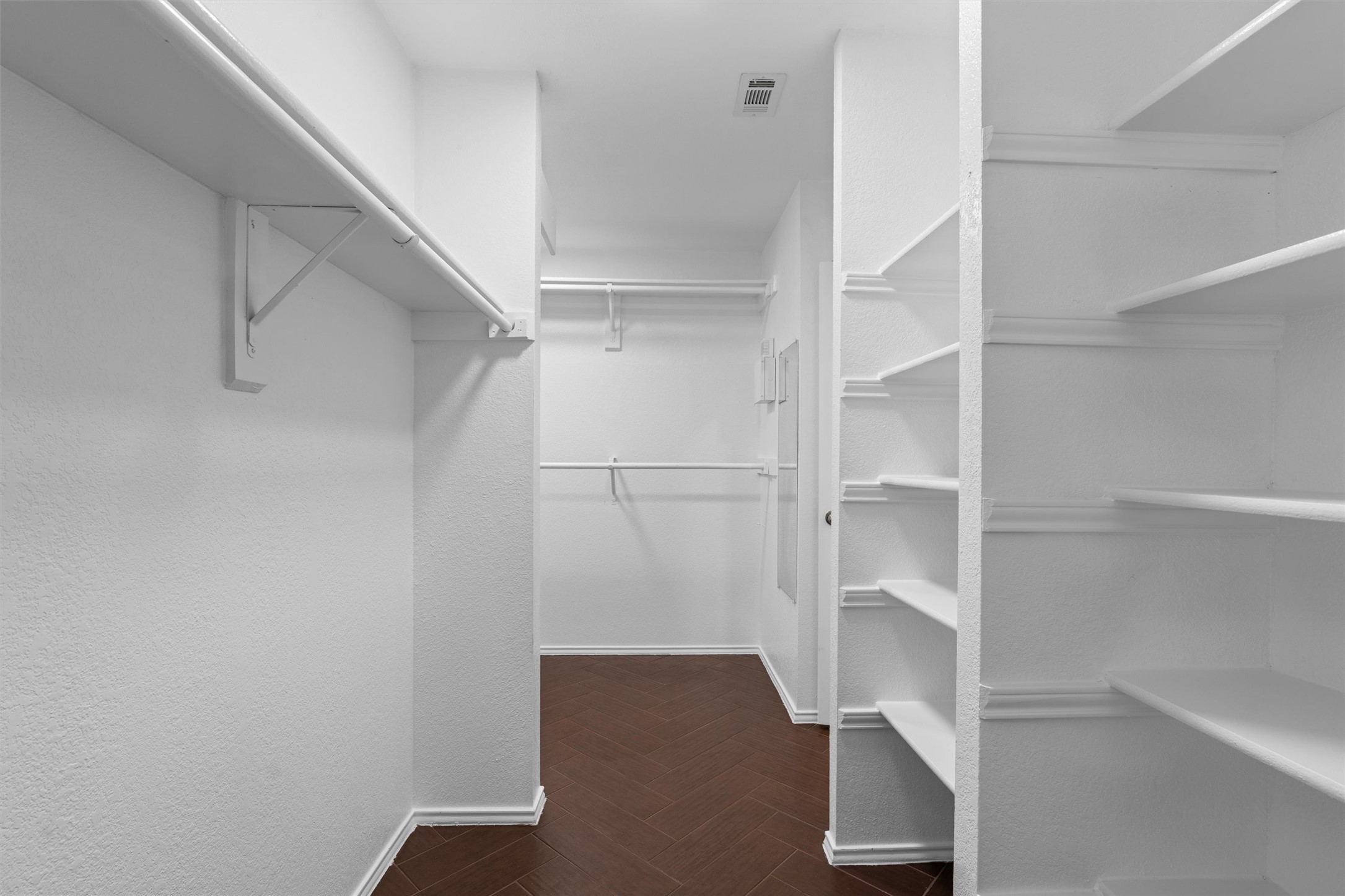 9305 Lightwood Loop Austin, TX 78748 - Photo 21 of 40 a view of walk in closet with empty racks