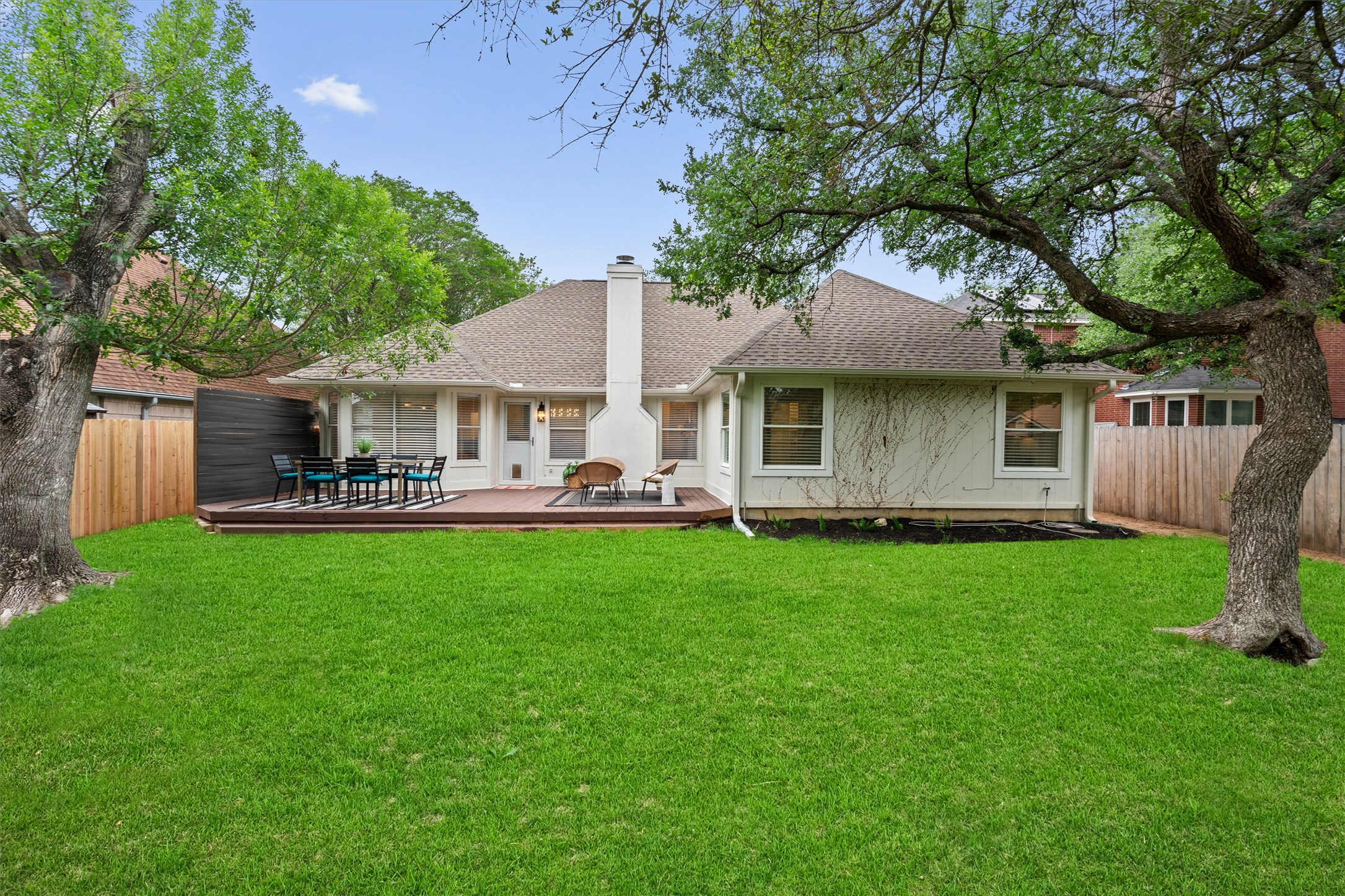 9305 Lightwood Loop Austin, TX 78748 - Photo 28 of 40 a backyard of a house with yard table and chairs