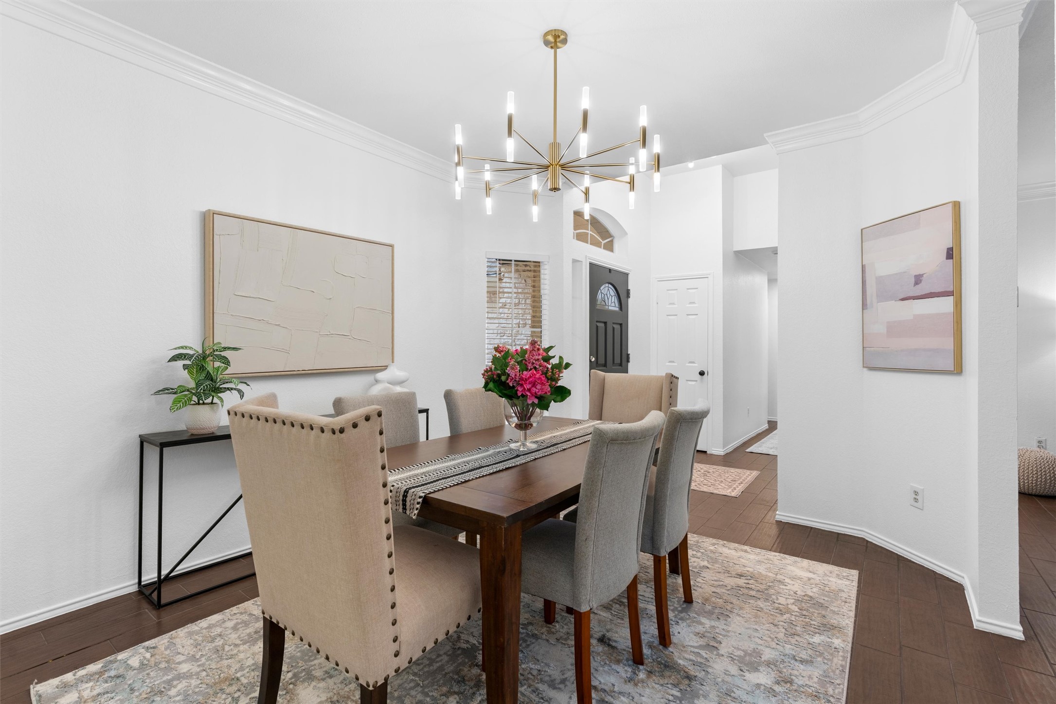 9305 Lightwood Loop Austin, TX 78748 - Photo 5 of 40 a view of a dining room with furniture and a chandelier fan
