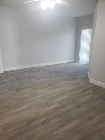 a view of room with wooden floor