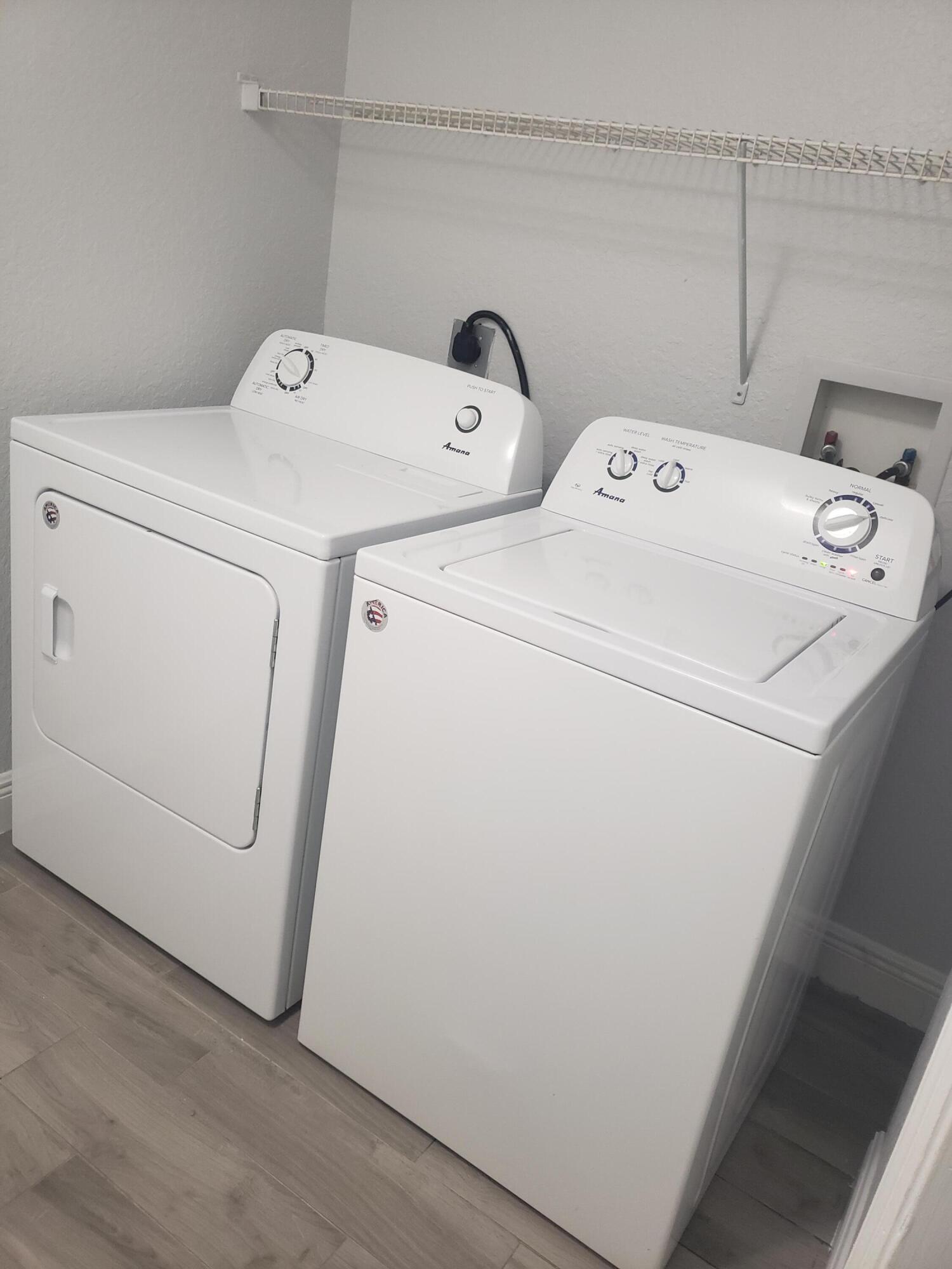 909 Belmont Place, Unit 909 Boynton Beach, FL 33436 - Photo 25 of 26 a utility room with dryer and washer