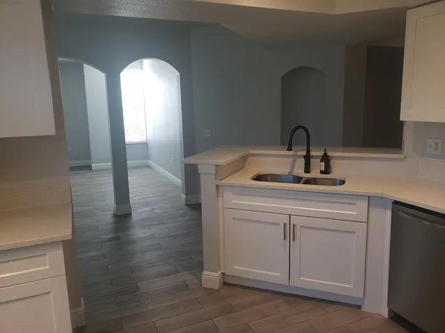 a kitchen with sink and window