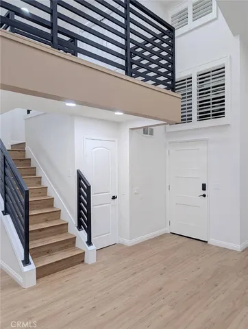 a view of entryway with wooden floor