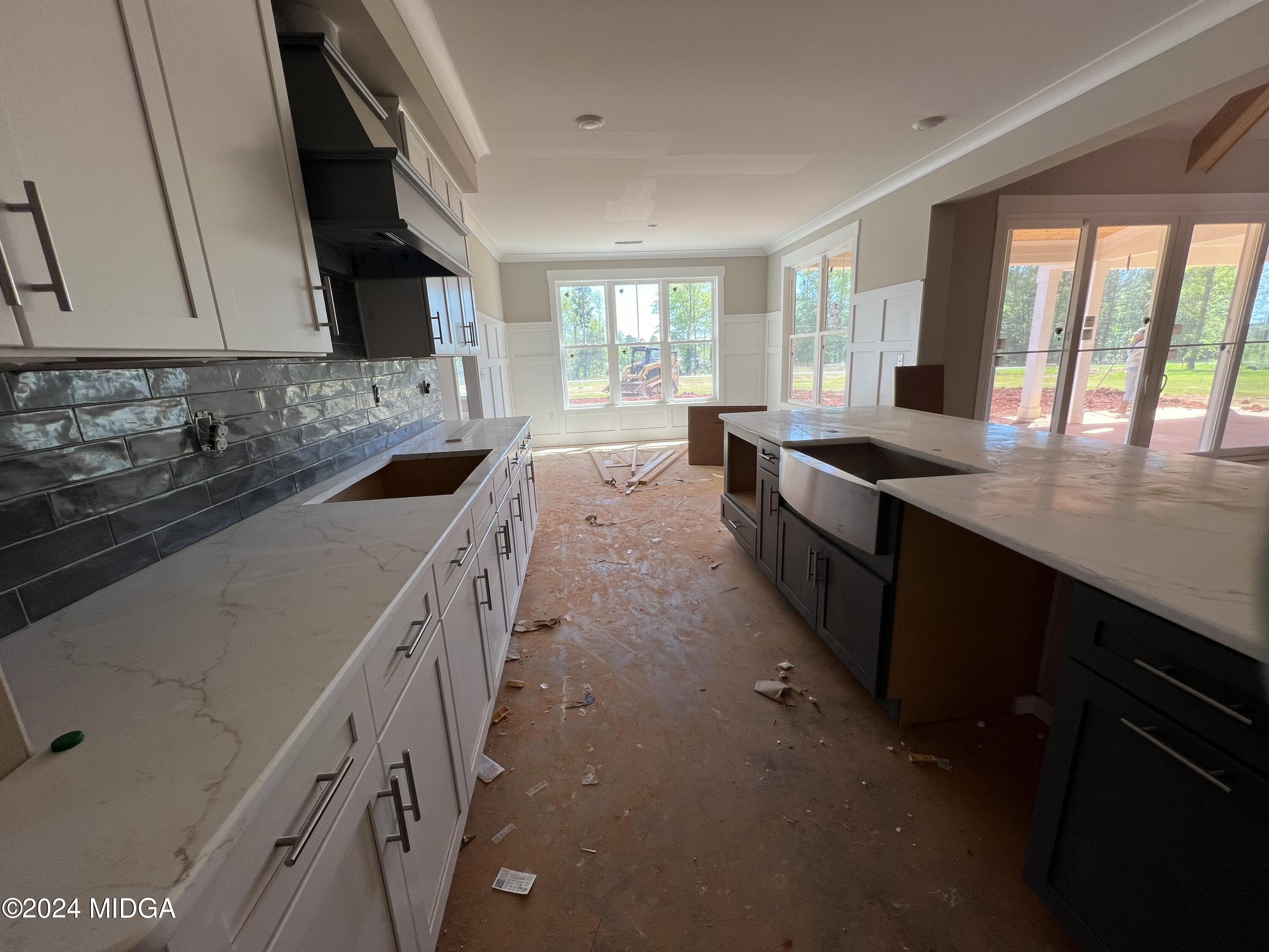 208 Copper Crossing Forsyth, GA 31029 - Photo 17 of 23 a kitchen with a sink stove and cabinets